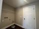 Laundry room complete with wire shelving, utility hookups, and luxury vinyl plank flooring at 1033 Sioux Swamp Dr., Conway, SC 29527