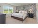 Bedroom with a queen-size bed and patterned wall at 3865 Lady Bug Dr., Shallotte, NC 28470