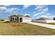 House exterior view showing a front yard with landscaping and driveway at 3865 Lady Bug Dr., Shallotte, NC 28470