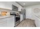 Modern kitchen with white cabinets and stainless steel appliances at 3865 Lady Bug Dr., Shallotte, NC 28470