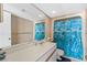 The full bathroom has a large mirror, white vanity, lighting, and blue dolphin themed shower curtain at 4719 S Ocean Blvd. # 209, North Myrtle Beach, SC 29582