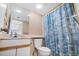 Bathroom with seashell-themed shower curtain at 4719 S Ocean Blvd. # 209, North Myrtle Beach, SC 29582