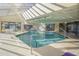 Bright indoor pool area with skylights, plenty of seating, and a shallow end at 4719 S Ocean Blvd. # 209, North Myrtle Beach, SC 29582