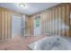 Bathroom with bathtub and carpet flooring at 1492 Fox Hollow Way, North Myrtle Beach, SC 29582