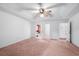 Primary bedroom with ceiling fan and carpet at 1492 Fox Hollow Way, North Myrtle Beach, SC 29582