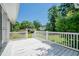 White deck with white railings overlooks a grassy backyard at 1492 Fox Hollow Way, North Myrtle Beach, SC 29582