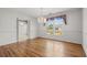 Bright dining room with hardwood floors, chandelier, and view of backyard at 1492 Fox Hollow Way, North Myrtle Beach, SC 29582