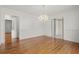 Spacious dining room featuring hardwood floors and a chandelier at 1492 Fox Hollow Way, North Myrtle Beach, SC 29582