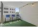 Private balcony with string lights and artificial turf at 209 75Th Ave. N # 10, Myrtle Beach, SC 29572