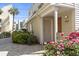 Exterior view of the condo building with flowers at 209 75Th Ave. N # 10, Myrtle Beach, SC 29572