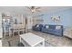 Bright living room features beachy decor, comfy sofas, and a dining area at 209 75Th Ave. N # 10, Myrtle Beach, SC 29572