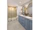 Stylish bathroom with double vanity, unique mirrors, and a glass enclosed shower at 2247 Sand Dunes Dr., Myrtle Beach, SC 29577