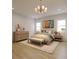 Well-lit bedroom with hardwood floors, neutral decor, and large windows providing ample natural light at 2247 Sand Dunes Dr., Myrtle Beach, SC 29577
