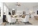 Bright living room with hardwood floors, neutral decor, ceiling fan, kitchen island, and modern recessed lighting at 2247 Sand Dunes Dr., Myrtle Beach, SC 29577