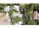 An aerial view shows the home's location within a lush, tree-filled neighborhood at 590 Collins Ave., Murrells Inlet, SC 29576