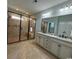 Modern bathroom featuring a spacious walk-in shower and a double sink vanity with granite countertops at 590 Collins Ave., Murrells Inlet, SC 29576