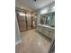 Modern bathroom featuring a spacious walk-in shower and a double sink vanity with granite countertops at 590 Collins Ave., Murrells Inlet, SC 29576