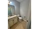 Efficient half bathroom with a granite countertop and under-sink storage at 590 Collins Ave., Murrells Inlet, SC 29576