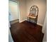 Entryway with dark wood flooring, table, decorative shelving unit and a fire extinguisher at 590 Collins Ave., Murrells Inlet, SC 29576