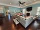 Comfortable living room with fireplace, TV, wood floors, and a ceiling fan at 590 Collins Ave., Murrells Inlet, SC 29576