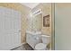Well-lit bathroom featuring a white vanity, neutral walls and patterned wallpaper at 601 Hillside Dr. N # 2903, North Myrtle Beach, SC 29582