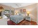 Comfortable bedroom with hardwood floors, a sliding glass door, and neutral decor at 601 Hillside Dr. N # 2903, North Myrtle Beach, SC 29582