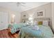 Bedroom with two twin beds, floral quilts, ceiling fan and adjoining bathroom entrance at 601 Hillside Dr. N # 2903, North Myrtle Beach, SC 29582
