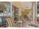 Screened porch with patio furniture and views of the community and sliding glass doors at 601 Hillside Dr. N # 2903, North Myrtle Beach, SC 29582