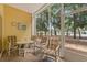 Relaxing screened porch with patio furniture, and view of tennis court at 601 Hillside Dr. N # 2903, North Myrtle Beach, SC 29582