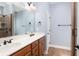 Double vanity bathroom with marble countertop and tile floors at 627 3Rd Ave. S, Surfside Beach, SC 29575