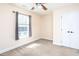 Bright bedroom with carpeted floor, large window, and double doors closet at 627 3Rd Ave. S, Surfside Beach, SC 29575