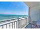 A balcony view of the beach, complete with seating on the outdoor patio at 1207 S Ocean Blvd. # 20808, Myrtle Beach, SC 29577