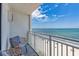 A balcony view of the beach, complete with seating on the outdoor patio at 1207 S Ocean Blvd. # 20808, Myrtle Beach, SC 29577