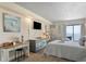 Bright bedroom with desk, dresser, and comfy beds overlooking the ocean at 1207 S Ocean Blvd. # 20808, Myrtle Beach, SC 29577