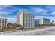 Coastal condo building featuring multiple floors, each with private balconies, overlooking a sandy beach at 1207 S Ocean Blvd. # 20808, Myrtle Beach, SC 29577