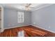 Hardwood floor bedroom with ceiling fan and shutters at 1335 Hidden Harbor Rd., Myrtle Beach, SC 29577