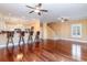 Open concept living room with hardwood floors and kitchen bar at 1335 Hidden Harbor Rd., Myrtle Beach, SC 29577