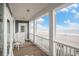 Relaxing balcony with rocking chairs and stunning ocean views at 1907 S Waccamaw Dr., Garden City Beach, SC 29576