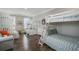 Spacious bedroom with multiple bunk beds, seating and lots of natural light at 1907 S Waccamaw Dr., Garden City Beach, SC 29576