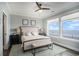 Cozy bedroom with a king-size bed, ocean view, and beach-themed decor at 1907 S Waccamaw Dr., Garden City Beach, SC 29576