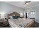 Bedroom with a queen-size bed, side tables, and a view to the kitchen at 1907 S Waccamaw Dr., Garden City Beach, SC 29576