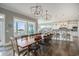 Spacious dining room with large table and open layout to the kitchen at 1907 S Waccamaw Dr., Garden City Beach, SC 29576