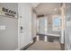 Light and airy foyer with coastal decor and natural light shining through the front door at 1907 S Waccamaw Dr., Garden City Beach, SC 29576
