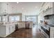 Spacious kitchen with stainless steel appliances, white cabinetry, and an adjacent dining area with ocean views at 1907 S Waccamaw Dr., Garden City Beach, SC 29576