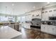 Modern kitchen featuring white cabinetry, stainless steel appliances, and ocean views at 1907 S Waccamaw Dr., Garden City Beach, SC 29576