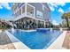 Private pool and spa area with water features, ideal for relaxation and recreation at 1907 S Waccamaw Dr., Garden City Beach, SC 29576