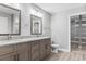 Double vanity bathroom with granite countertops and walk-in closet at 2260 Pearl Rd., Galivants Ferry, SC 29544