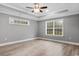 Bright bedroom with ceiling fan and large windows at 2260 Pearl Rd., Galivants Ferry, SC 29544