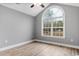 Bedroom with vaulted ceiling, large window, and hardwood floors at 2260 Pearl Rd., Galivants Ferry, SC 29544