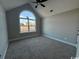 Bedroom with arched window and ceiling fan at 2260 Pearl Rd., Galivants Ferry, SC 29544